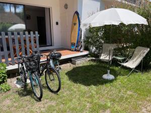 Κήπος έξω από το Appartement avec chambre, terrasse et jardinet proche plage, forêt pins, piste cyclable, lac