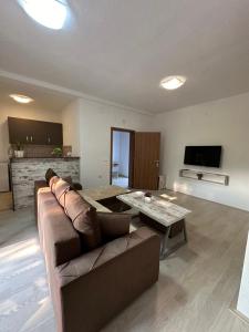 a living room with a couch and a table at Vila Snezana in Gevgelija