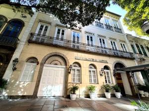 a large building with plants in front of it at Riale Imperial Flamengo in Rio de Janeiro
