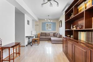a living room with a couch and a table at Votsalo Spetses in Spetses