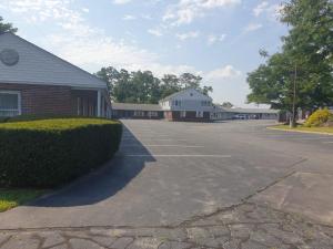 an empty parking lot in front of a building at Town & Country Inn in Seekonk