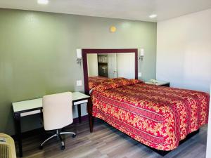 Postel nebo postele na pokoji v ubytování A Fisher's Inn Motel