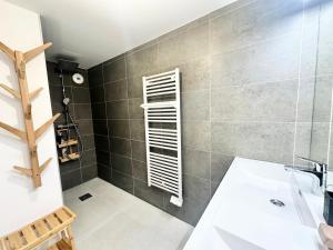 a bathroom with a sink and a bath tub at Résidence Le Solea - SOLEA - SPA ET SAUNA, NOUVEAU SUR VARS MAE-2941 in Vars +22 photos