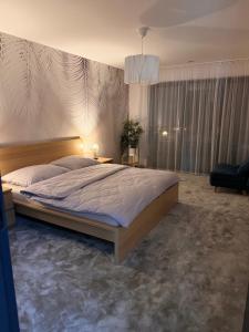 Ένα ή περισσότερα κρεβάτια σε δωμάτιο στο Indigo Home