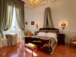 Postel nebo postele na pokoji v ubytování Palazzo De Castro + 37 fotografií