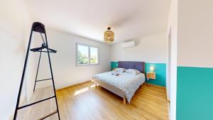 Ένα ή περισσότερα κρεβάτια σε δωμάτιο στο Villa des Grands Crus 5 suites Calme NoFête