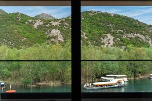 a view from a window of a boat in the water at Hotel De‘Andros Virpazar in Virpazar