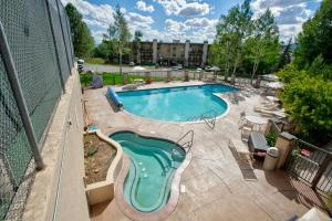 an overhead view of a swimming pool at a hotel at Storm Meadows Club A-219, Corner Unit, Amazing Panoramic Views, Ski In Ski Out, Club Amenities in Steamboat Springs