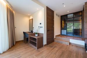 a home office with a desk and a window at Hotel De‘Andros Virpazar in Virpazar