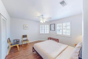 a bedroom with a bed and a ceiling fan at Valparaiso Desert Paradise in Desert Hot Springs +20 photos