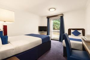 Postel nebo postele na pokoji v ubytování Ramada Oxford