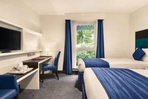 Postel nebo postele na pokoji v ubytování Ramada Oxford