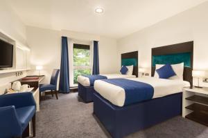 Postel nebo postele na pokoji v ubytování Ramada Oxford
