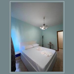 Postel nebo postele na pokoji v ubytování NEO Apartments + 1 fotografie