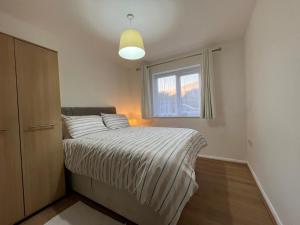 a bedroom with a bed and a window at Kilnview Guesthouse-Hanley & Staffordshire University in Stoke on Trent