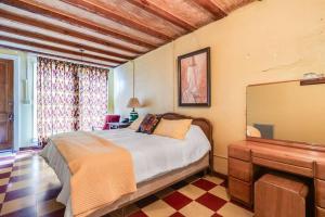 a bedroom with a bed and a large mirror at Downtown Scott Studio Near I-10, Walk to Dining in Scott