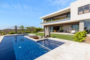 an image of a house with a swimming pool at Near Punta Mita - Gorgeous Modern Villa in Higuera Blanca