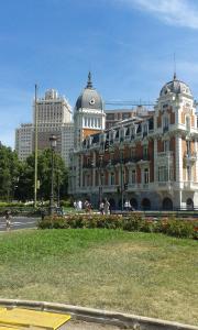 a large building on a street in a city at Hostal Buenos Aires in Madrid