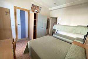 Postel nebo postele na pokoji v ubytování Hotel Cinzia