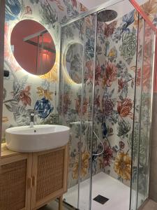 a bathroom with a sink and a shower at Casa mia MadamA in Gaeta