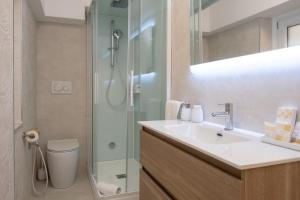 a bathroom with a sink and a shower at Tosco Suite "Solis" in Sasso dʼOmbrone