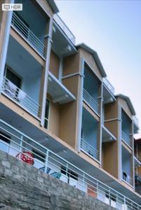 a building with balconies on the side of it at Water vibe hotel in Kalām +10 photos