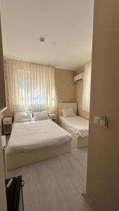Postel nebo postele na pokoji v ubytování Rota Star Hotel Beyoğlu