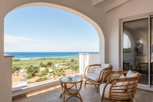 a living room with a view of the ocean at Villa Atalis in Son Bou