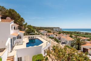 an image of a villa with a swimming pool and the ocean at Villa Atalis in Son Bou