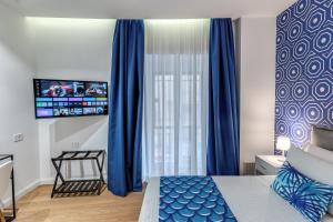 Ένα ή περισσότερα κρεβάτια σε δωμάτιο στο Nibla's Room Napoli