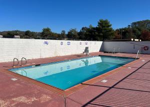 a swimming pool on top of a building at Studio 6 Suites Cameron Park, CA Folsom in Cameron Park
