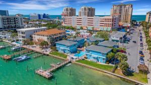 an aerial view of a city with a marina at Water View & Heated Pool - Steps to Sand, Bayview Beauty B-5 in Clearwater Beach