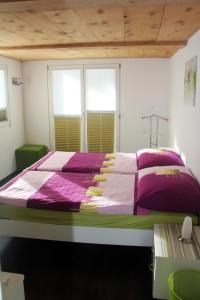 Кровать или кровати в номере Haus Rosa