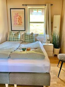 a bedroom with a bed with a bowl on it at Spacious cabin with a fabulous view and a sauna in Skulestadmo