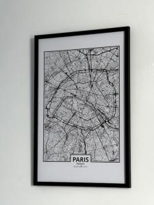 a framed picture of a map of paris at Rose in Bellême