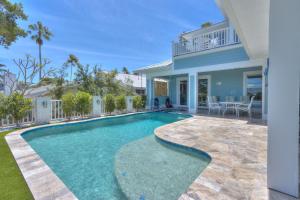 a swimming pool in the backyard of a house at Dream Vacation Beach House in Clearwater Beach