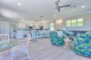 a living room and kitchen with a couch and a table at Dream Vacation Beach House in Clearwater Beach