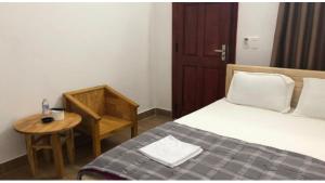 Postel nebo postele na pokoji v ubytování An Ngọc Linh Hotel
