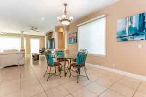 a dining room with a table and chairs at Sweet Escape - Monthly Beach Rental in Clearwater Beach