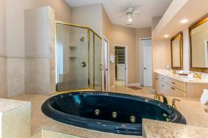 a large bathroom with a tub and a shower at Sweet Escape - Monthly Beach Rental in Clearwater Beach +71 photos