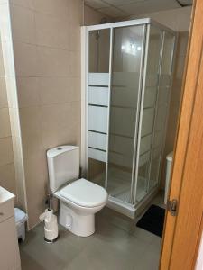 a bathroom with a toilet and a glass shower at Apartment C6 Phase 4 Mojon Hills, Isla Plana, CERTIFICATE OF EXCELLENCE in Isla Plana