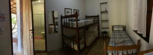 Cama ou camas em um quarto em Pousada Caminho do Vale Guiné
