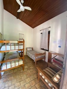 Cama ou camas em um quarto em Pousada Caminho do Vale Guiné