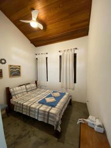 Cama ou camas em um quarto em Pousada Caminho do Vale Guiné