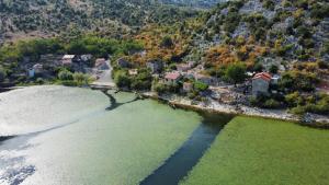 an aerial view of a town next to a body of water at Apartments Nikola in Bar