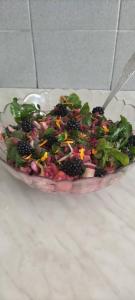 a salad in a glass bowl on a table at Apartments Nikola in Bar +21 photos