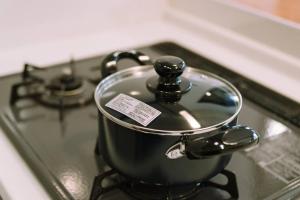 a pot sitting on top of a stove at DAHARA n-1 in Minami Aso