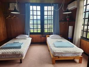 Postel nebo postele na pokoji v ubytování ロッヂノエル + 37 fotografií