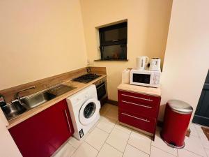 Kuchyň nebo kuchyňský kout v ubytování Dormitorio Grande D08