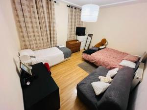 Postel nebo postele na pokoji v ubytování Dormitorio Grande D08